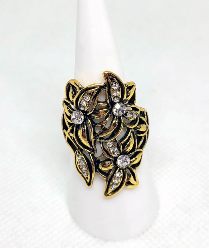 Large gold flower white stone ring
