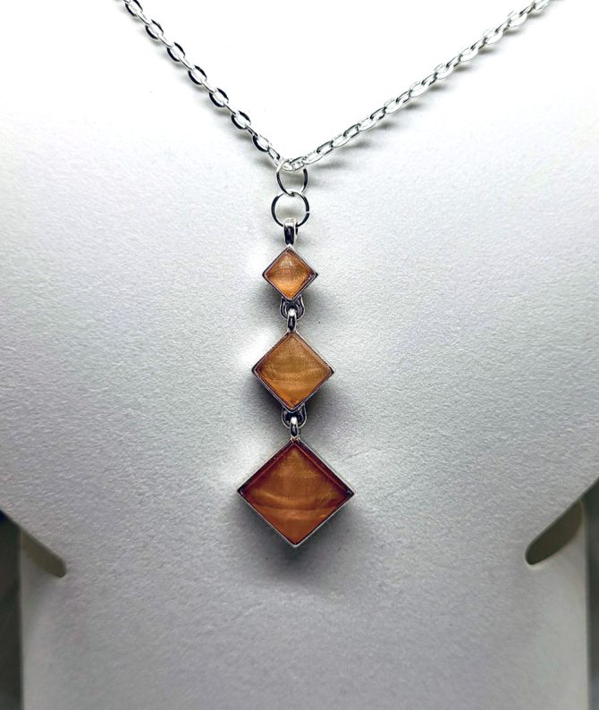 Three square amber colour drop necklace