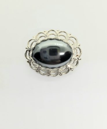 Small black brooch