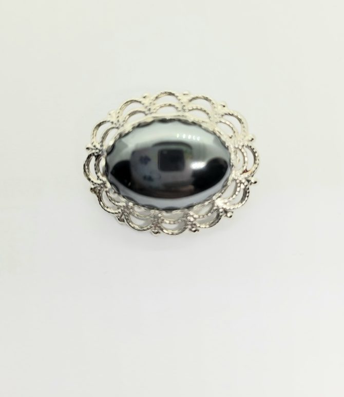 Small black brooch