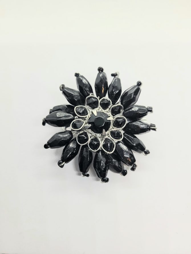 Black flower brooch